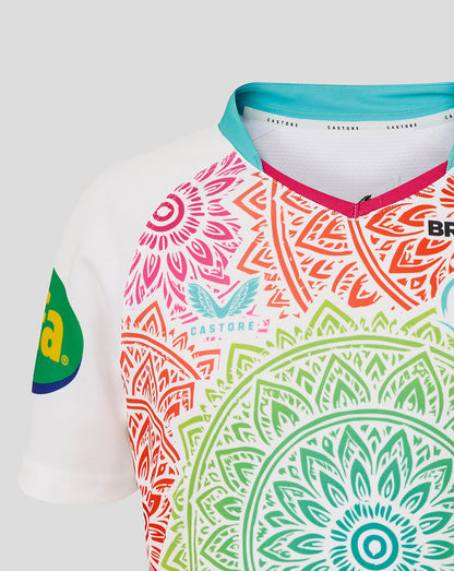 Colorful patterned shirt with brand logos on a white background