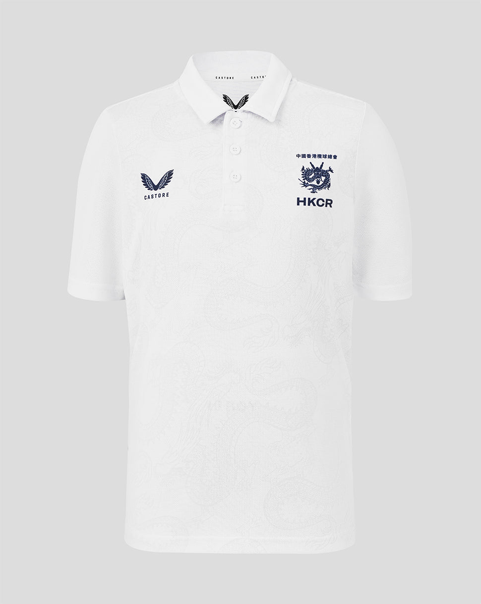 White polo shirt with embroidered logos on a light gray background