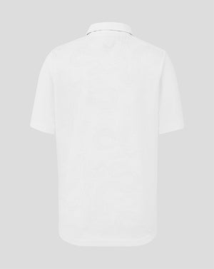 White polo shirt on a light gray background