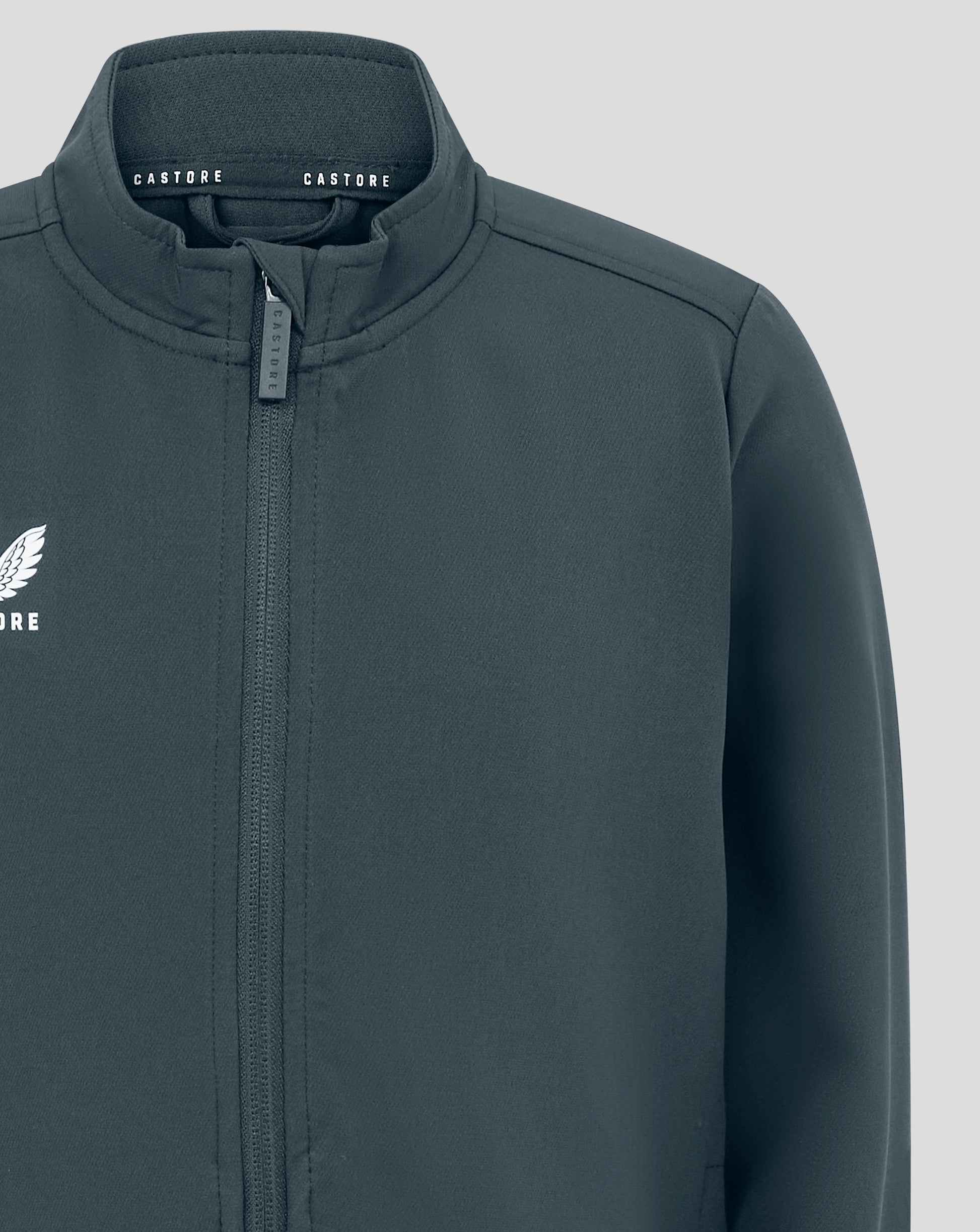 Junior Track Jacket in dark slate close up of collar with full zip and Castore branding