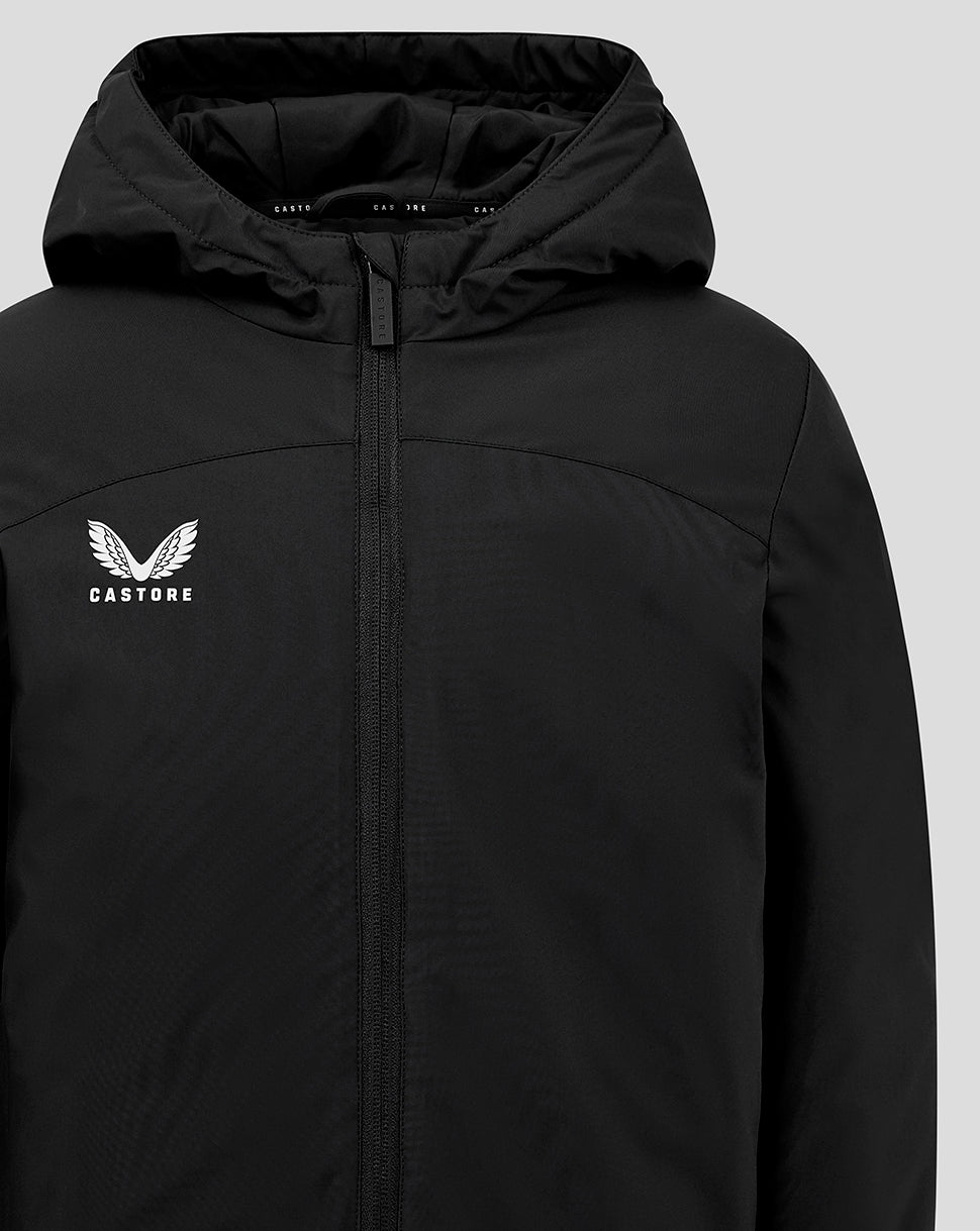 Front view of black Junior Standard Length Bench Jacket with hood and white winged Castore logo on the chest.