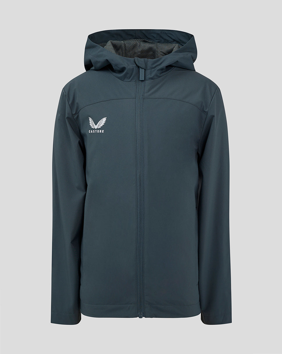 Junior rain jacket in dark slate with hood and front zipper and Castore logo on the left chest