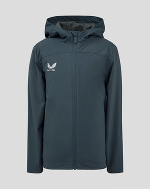 Junior rain jacket in dark slate with hood and front zipper and Castore logo on the left chest