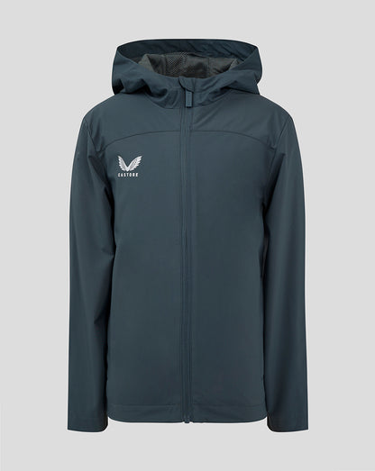 Junior rain jacket in dark slate with hood and front zipper and Castore logo on the left chest