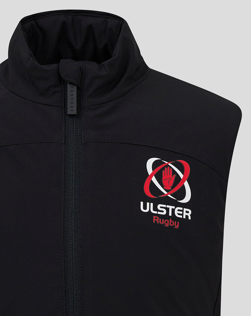 Close-up of black padded gilet showing the Ulster Rugby crest on the chest and a front zipper with a tall standing collar.