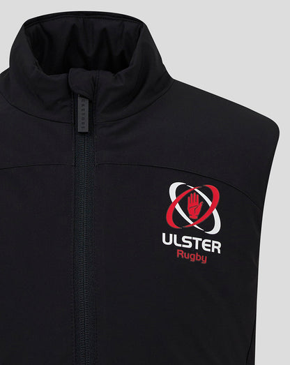 Close-up of black padded gilet showing the Ulster Rugby crest on the chest and a front zipper with a tall standing collar.