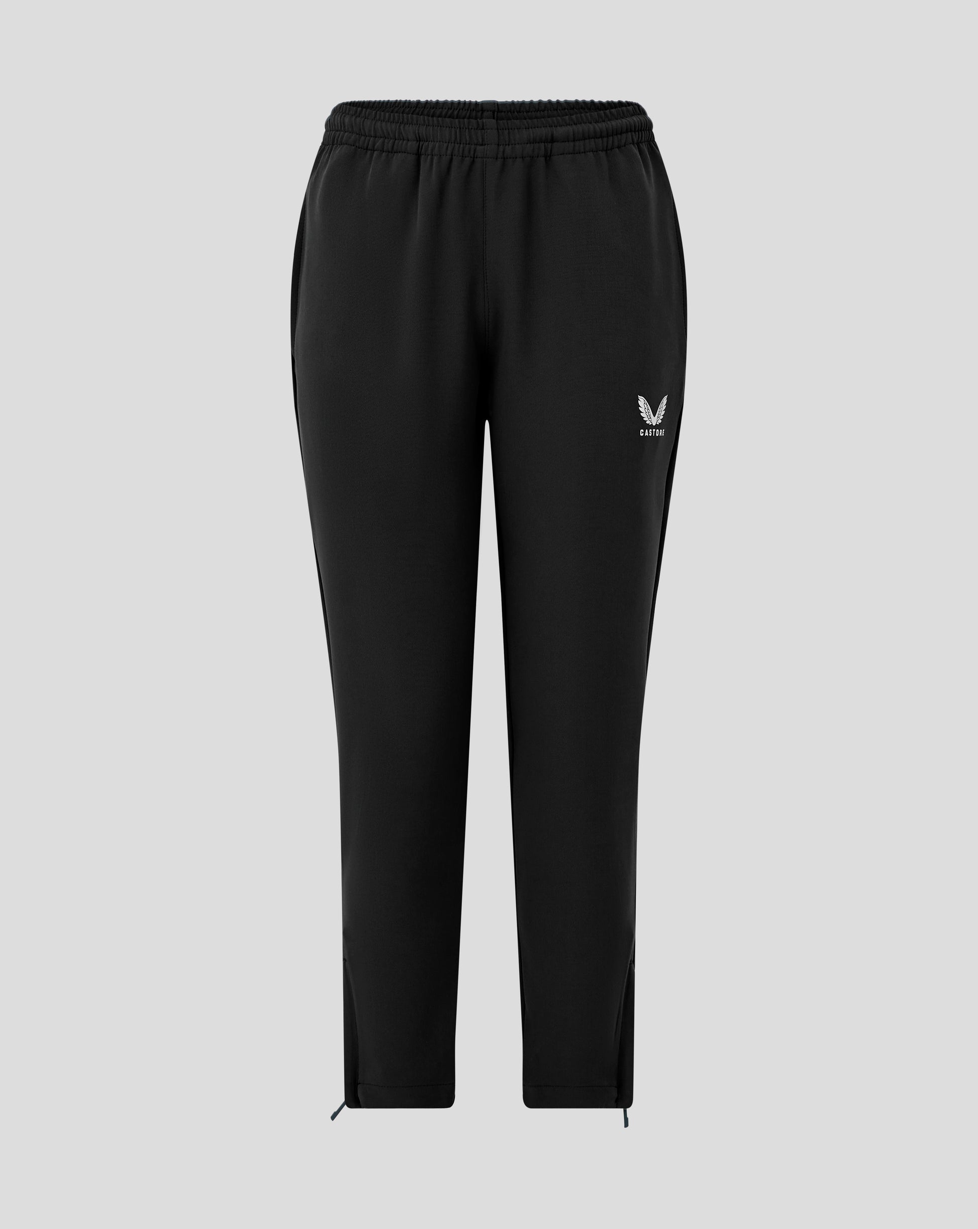 Front view of black Junior Track Pant with drawcord waist and Castore logo at the hip