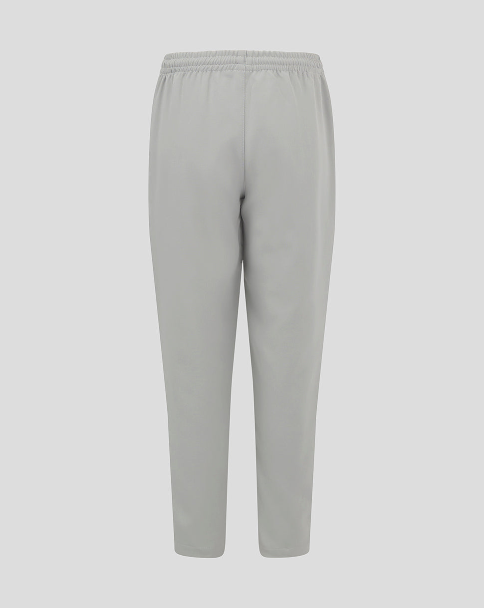 Light grey junior track pants with an elastic waistband and tapered legs
