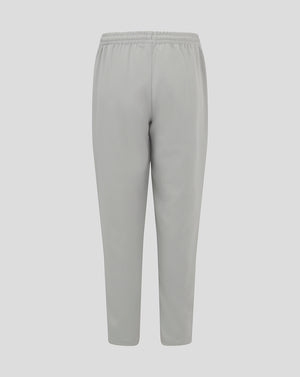 Light grey junior track pants with an elastic waistband and tapered legs