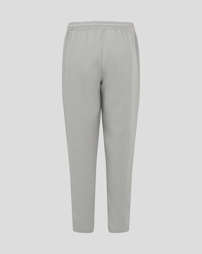 Light grey junior track pants with an elastic waistband and tapered legs