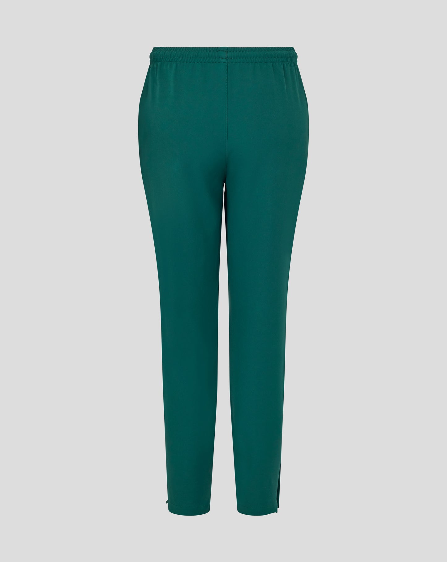 Front view of botanical green junior training track pants with white wing logo on the thigh.