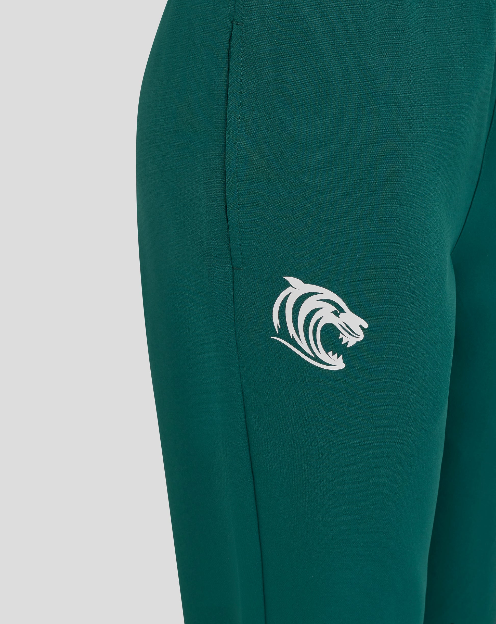 Green botanical Leicester Tigers junior training pant with a white tiger logo on the thigh.