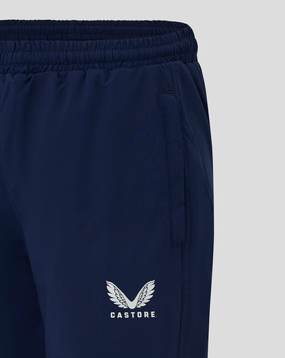 Close up of waistband on peacoat junior pant showing elastic band and Castore logo on the leg