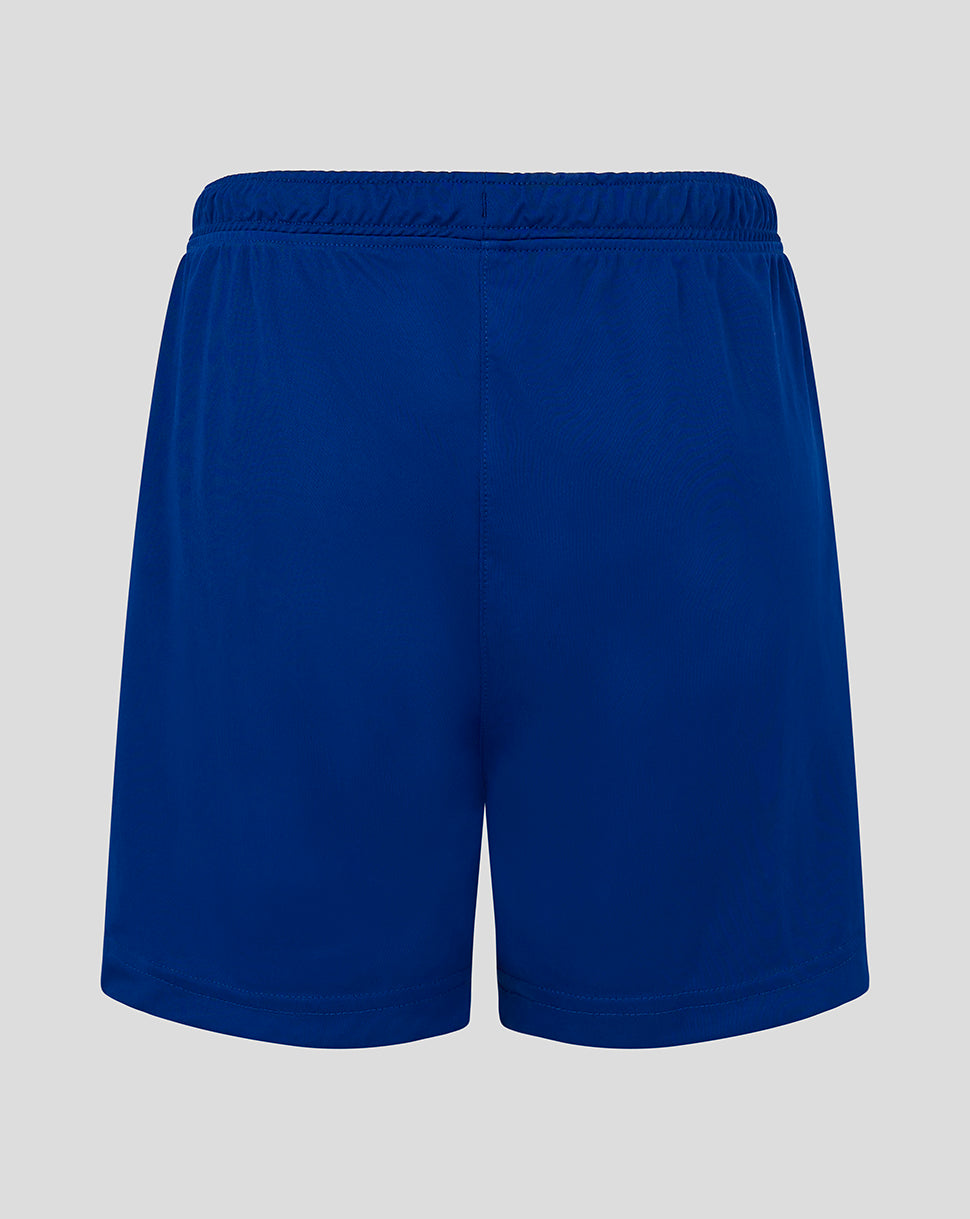Back view of blue junior match shorts with an elastic waistband and central seam
