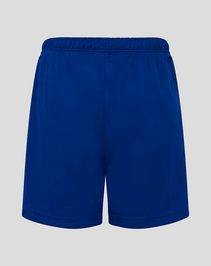 Back view of blue junior match shorts with an elastic waistband and central seam