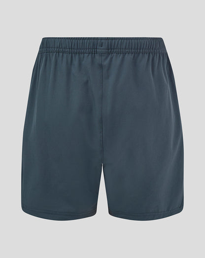 Back view of dark slate woven training shorts with elastic waistband and central rear seam.