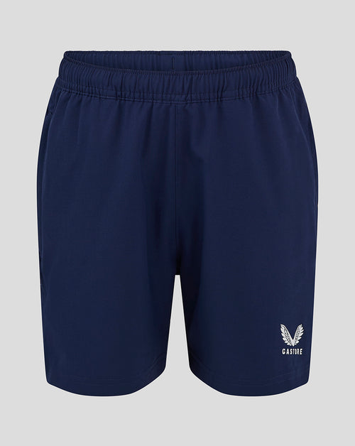 Front view of navy woven junior training shorts with a small white logo near the hem