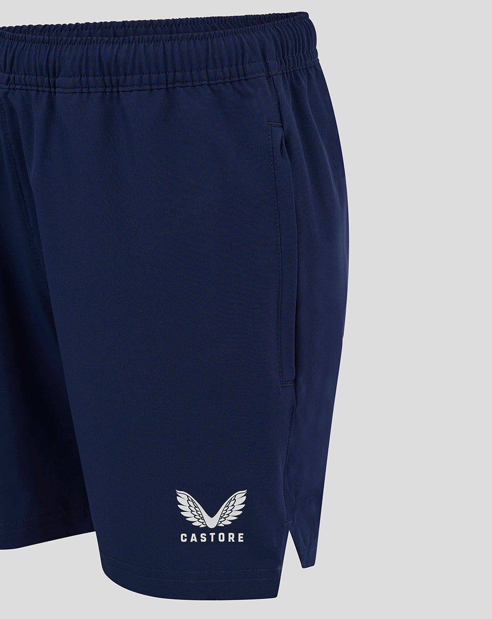 Side view of navy woven Junior Training Shorts with CASTORE logo near hem
