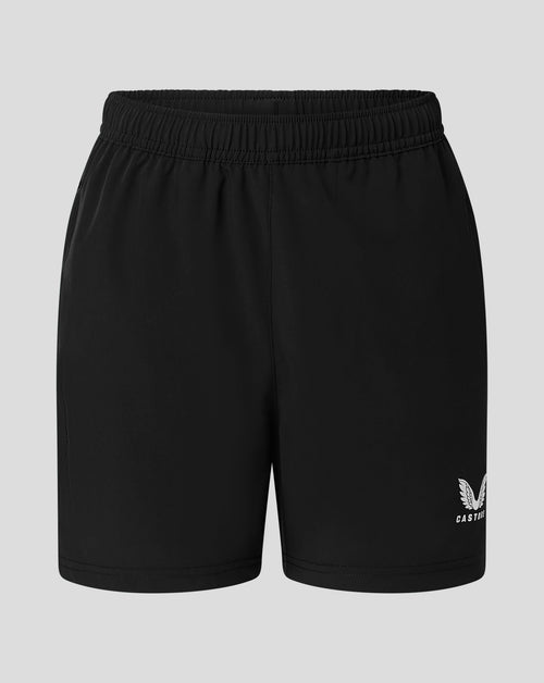 Back view of black junior woven training short with elastic waistband and Castore logo at the lower right