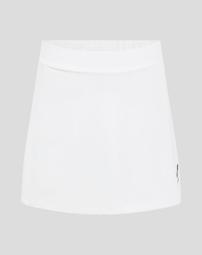 Close up of white junior skort waistband with elasticated band