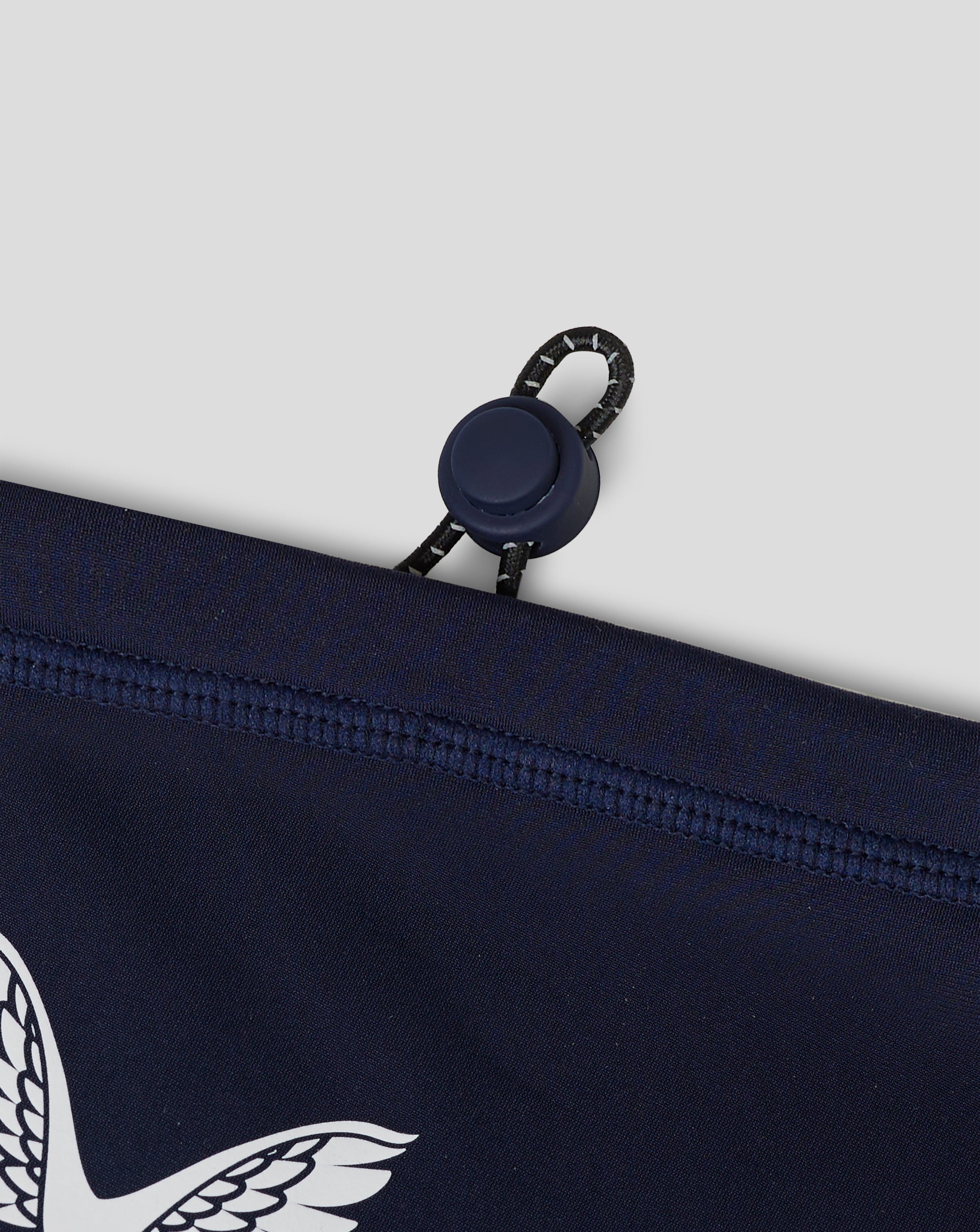 Rear view of navy Junior Performance Snood pouch with drawcord and curved hem