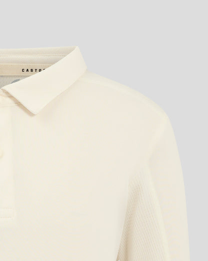 Front view of Cannoli Cream junior cricket shirt with Castore crest centered on chest
