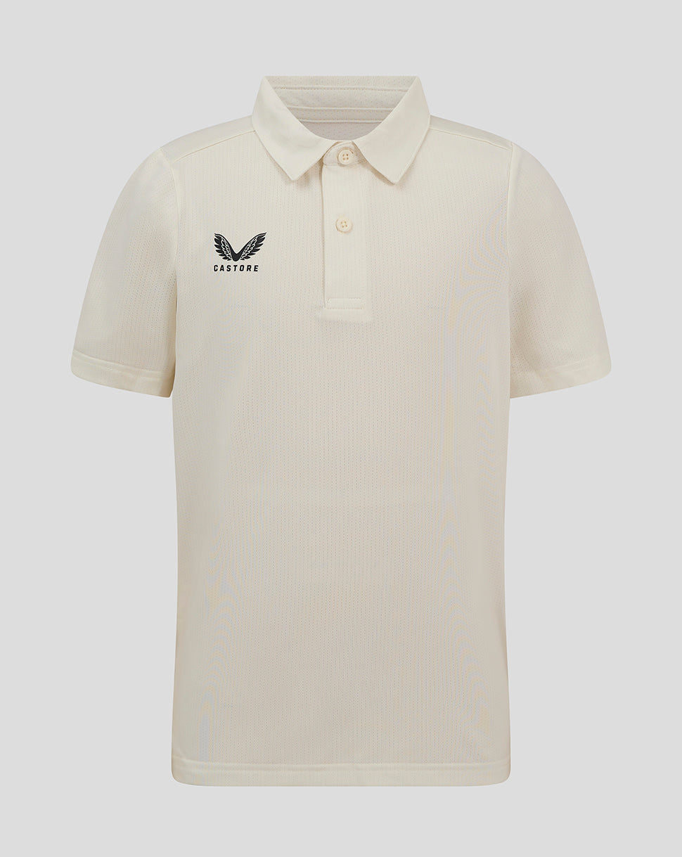 Junior Cannoli Cream cricket playing shirt with three button placket and forward shoulder seam