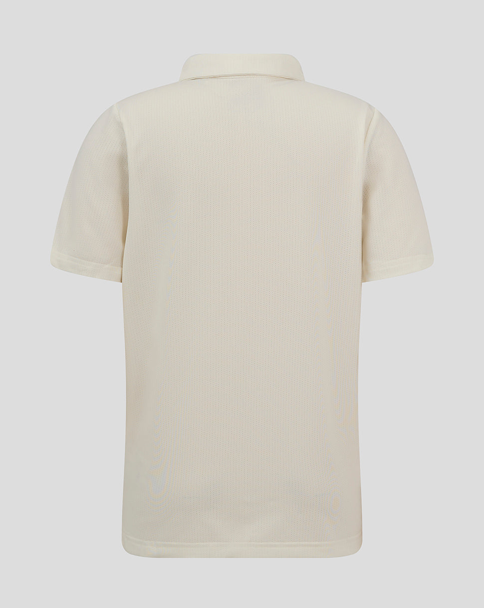 Back view of Cannoli Cream Junior Cricket Tech Playing Shirt showing perforated fabric and curved hem.