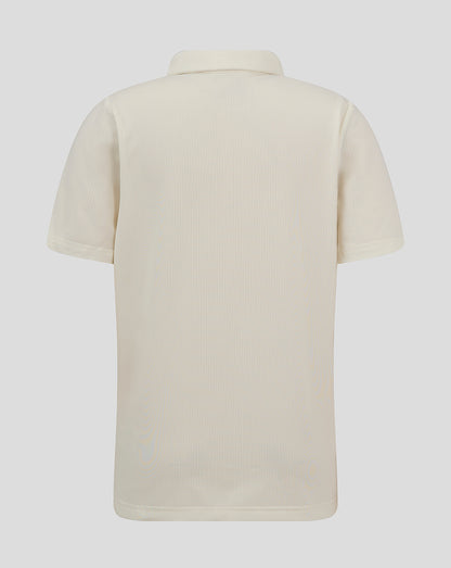 Back view of Cannoli Cream Junior Cricket Tech Playing Shirt showing perforated fabric and curved hem.
