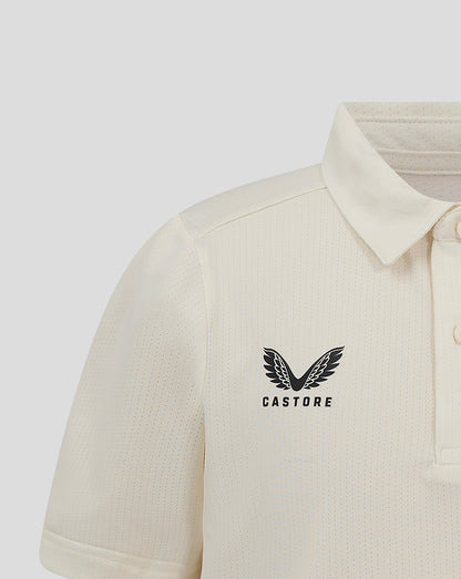 Front close-up of Cannoli Cream Junior Cricket Tech Playing Shirt with heat sealed Castore logo on chest.