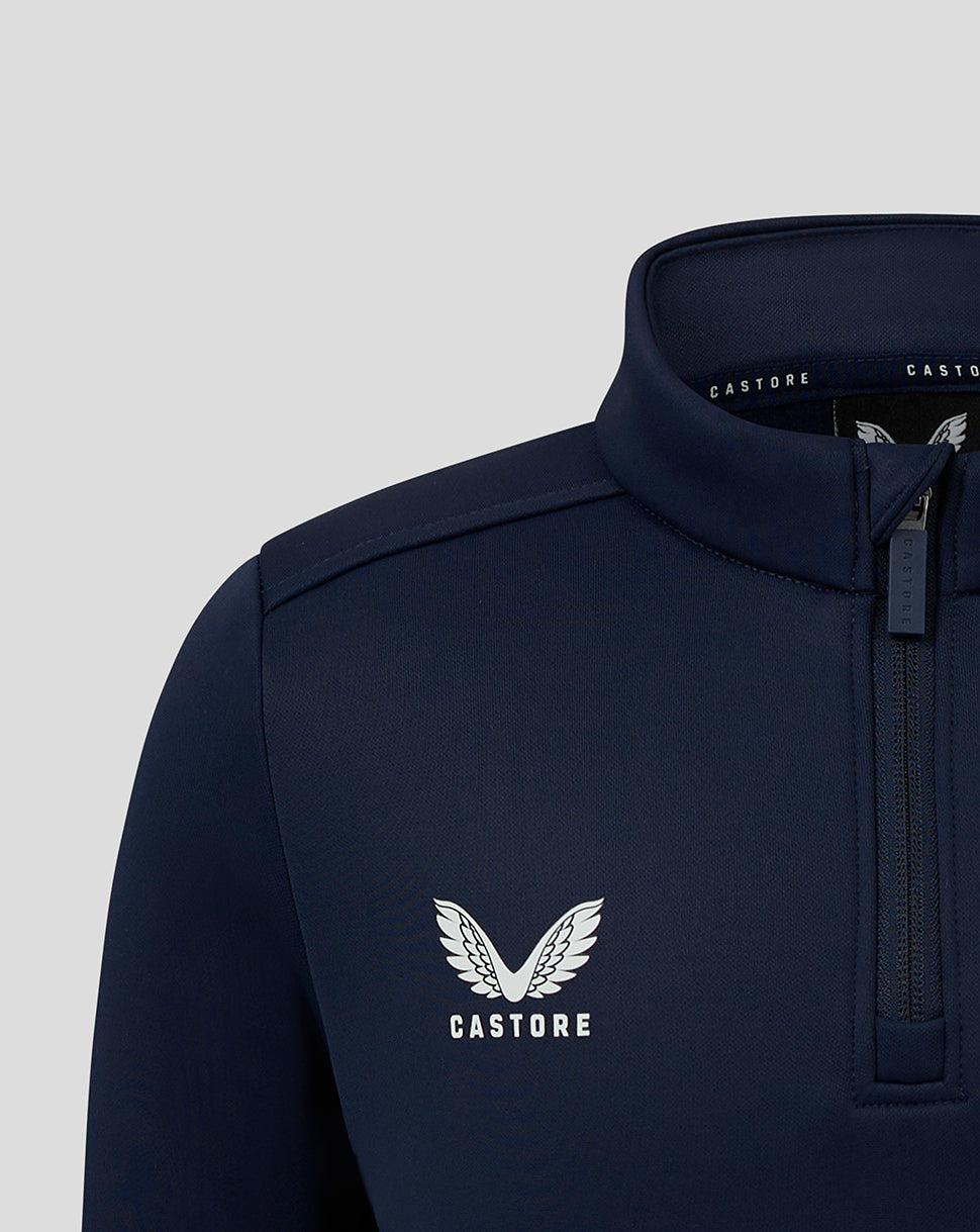 Close-up of navy fleece lined 1/4 Zip showing Castore logo on chest and zip details at the collar