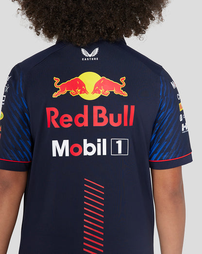 Back view of the navy Red Bull Racing polo with large Red Bull and Mobil 1 logos and a red diagonal stripe down the back