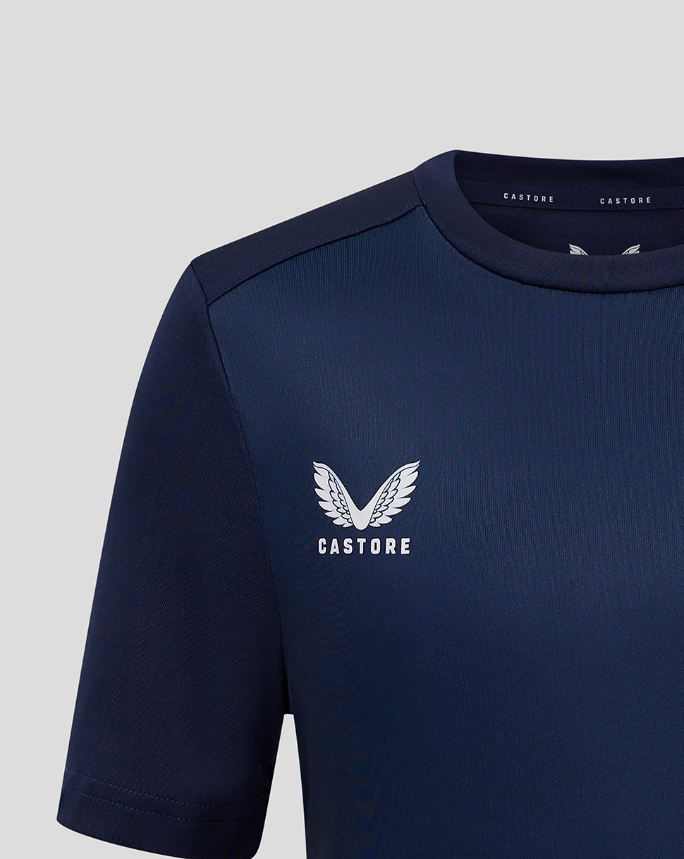 Close up of a navy gradient training tee showing the Castore logo on the chest.