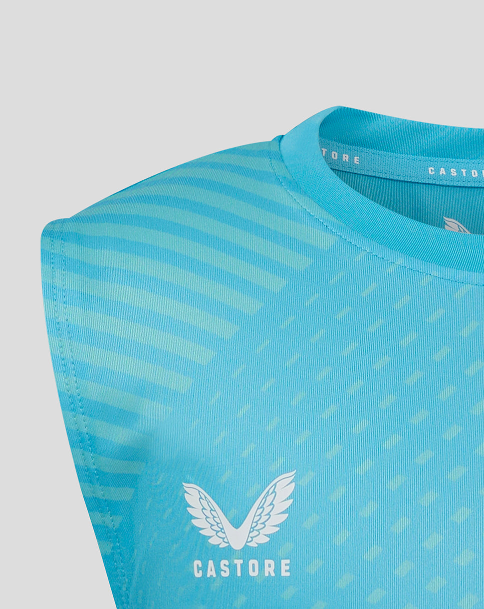 Close-up of aqua blue geometric printed training tee with diagonal pattern and Castore wing logo on the chest