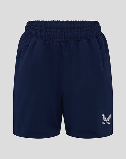 Front view of navy blue junior long length training shorts with elastic waistband and a small logo on the leg