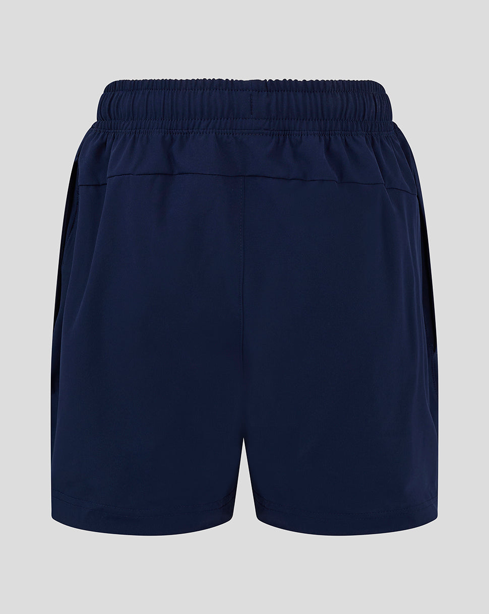 Back view of navy junior long length training shorts with elastic waistband