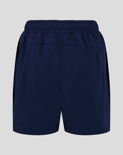 Back view of navy junior long length training shorts with elastic waistband