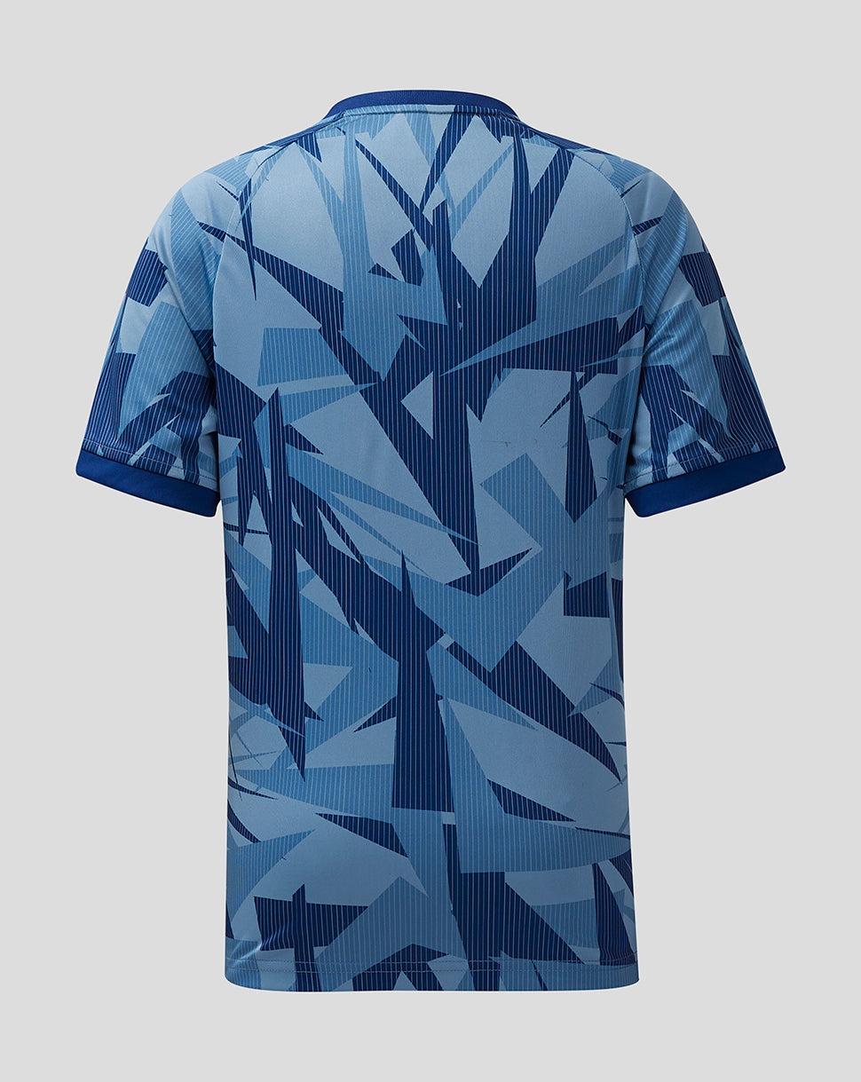 Back view of Aston Villa junior 23/24 third shirt in blue geometric print with dark blue cuffs.