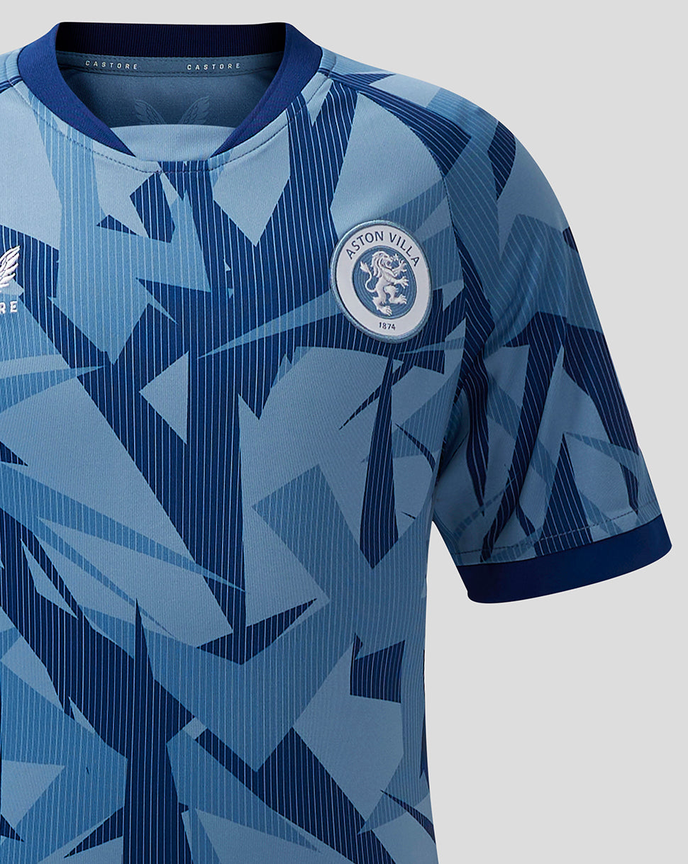 Aston Villa Junior 23/24 third shirt with a blue geometric pattern and club crest.