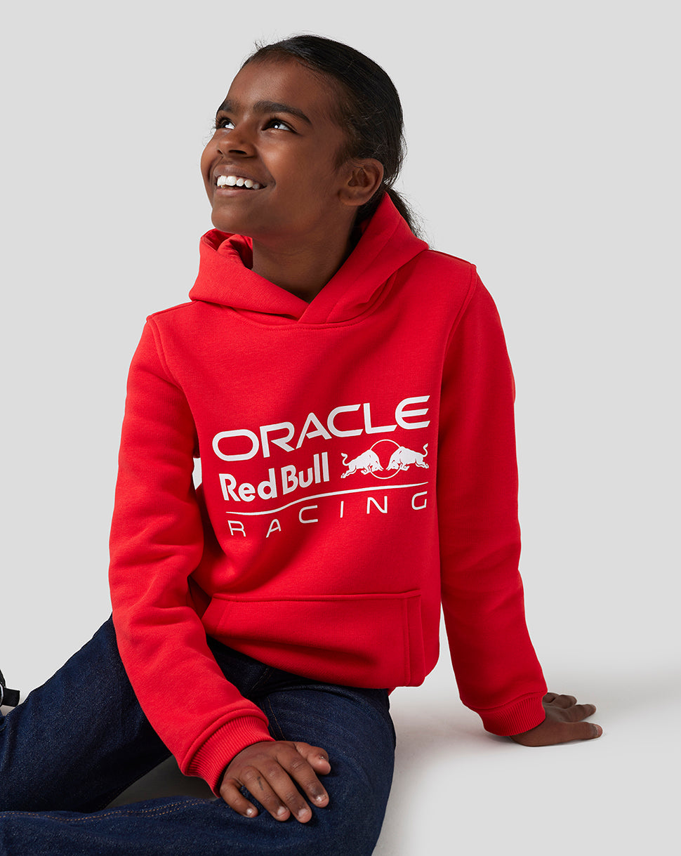 Child wearing flame scarlet Oracle Red Bull Racing Core Overhead Hoodie with large white logo.