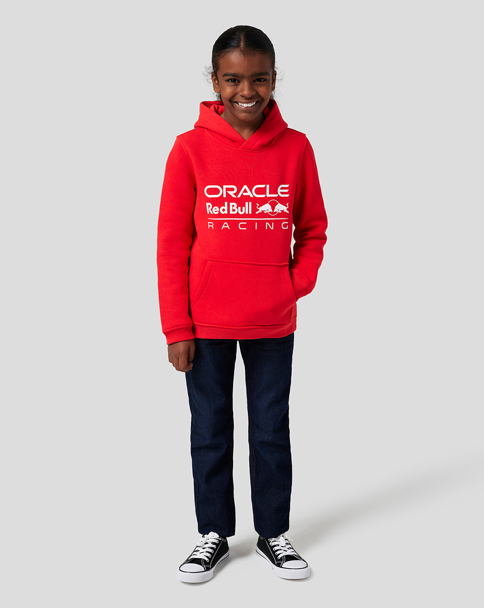 Junior Flame Scarlet Oracle Red Bull Racing Core Overhead Hoodie worn by a smiling child