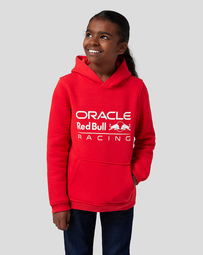 Happy girl in Flame Scarlet Oracle Red Bull Racing hoodie with logo on chest and front pocket