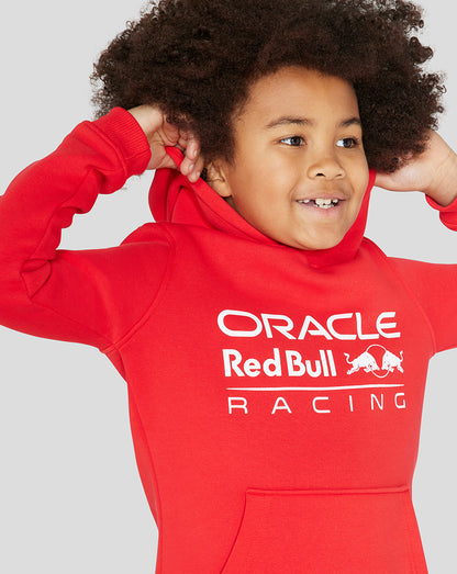 Child wearing a flame scarlet Oracle Red Bull Racing Core Overhead Hoodie with a large white logo