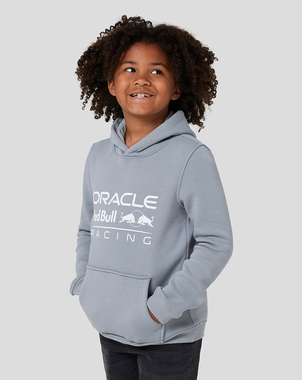 Young child wearing a grey Oracle Red Bull Racing hoodie with a large front logo