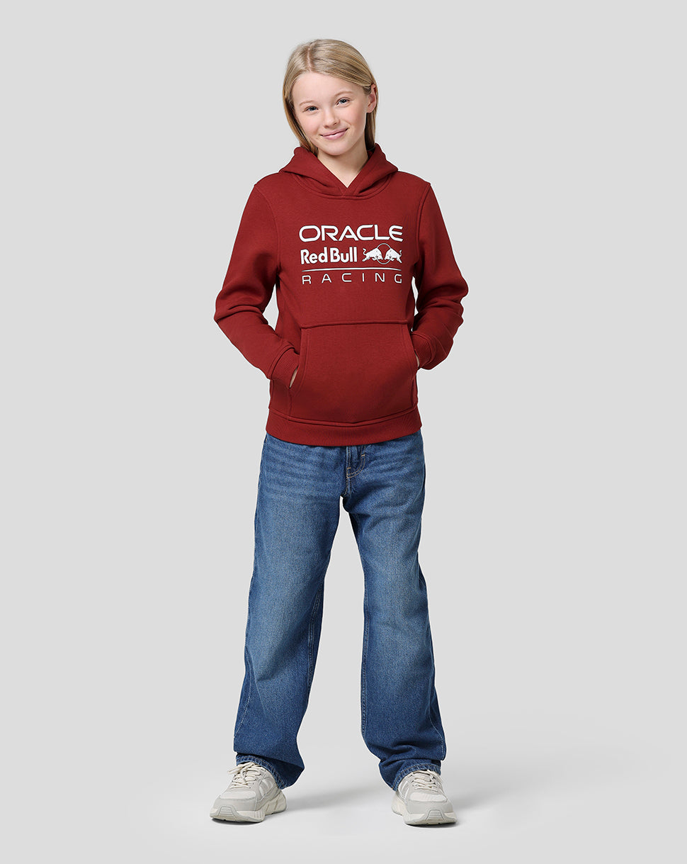 Young girl in winery red Oracle Red Bull Racing hoodie with front logo