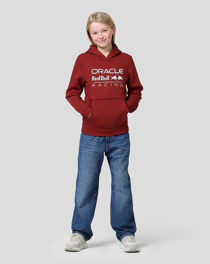 Young girl in winery red Oracle Red Bull Racing hoodie with front logo