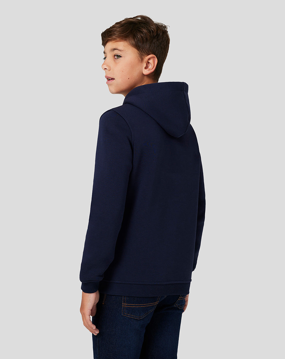 Side view of a boy in navy brushback Core Overhead Hoodie with hood up