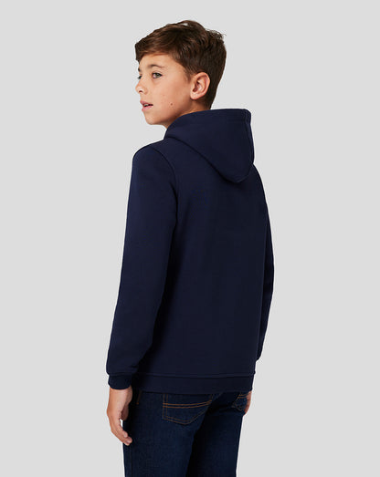 Side view of a boy in navy brushback Core Overhead Hoodie with hood up