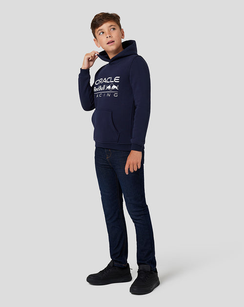 Boy wearing navy Oracle Red Bull Racing Core Overhead Hoodie Night Sky with a large logo