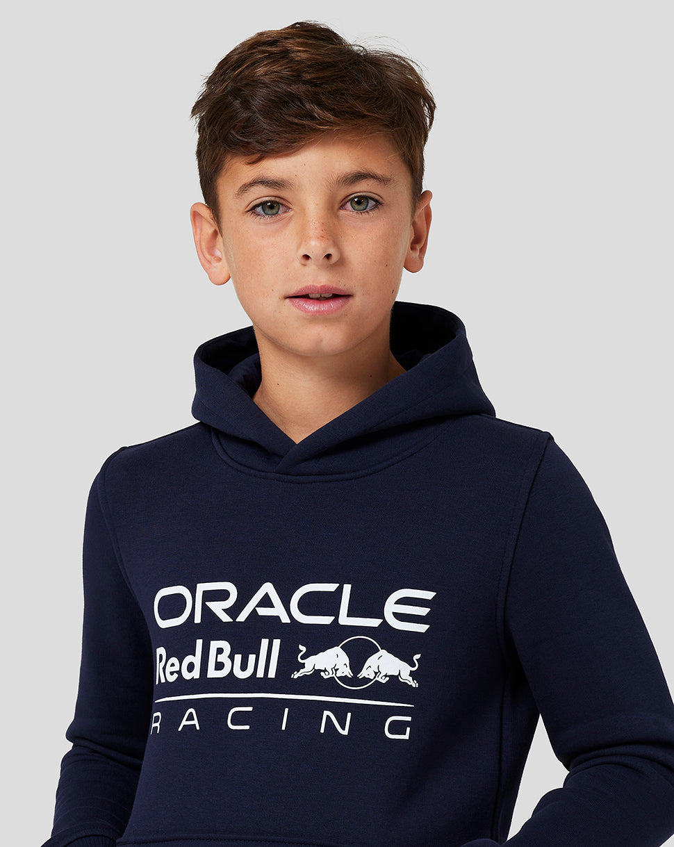 Boy wearing Night Sky Core Overhead Hoodie with Oracle Red Bull Racing logo